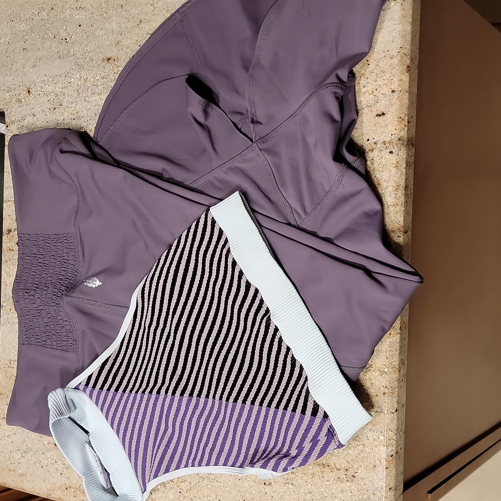 Free People workout legging and top. Top is NWT size M. Exterior logo on both.